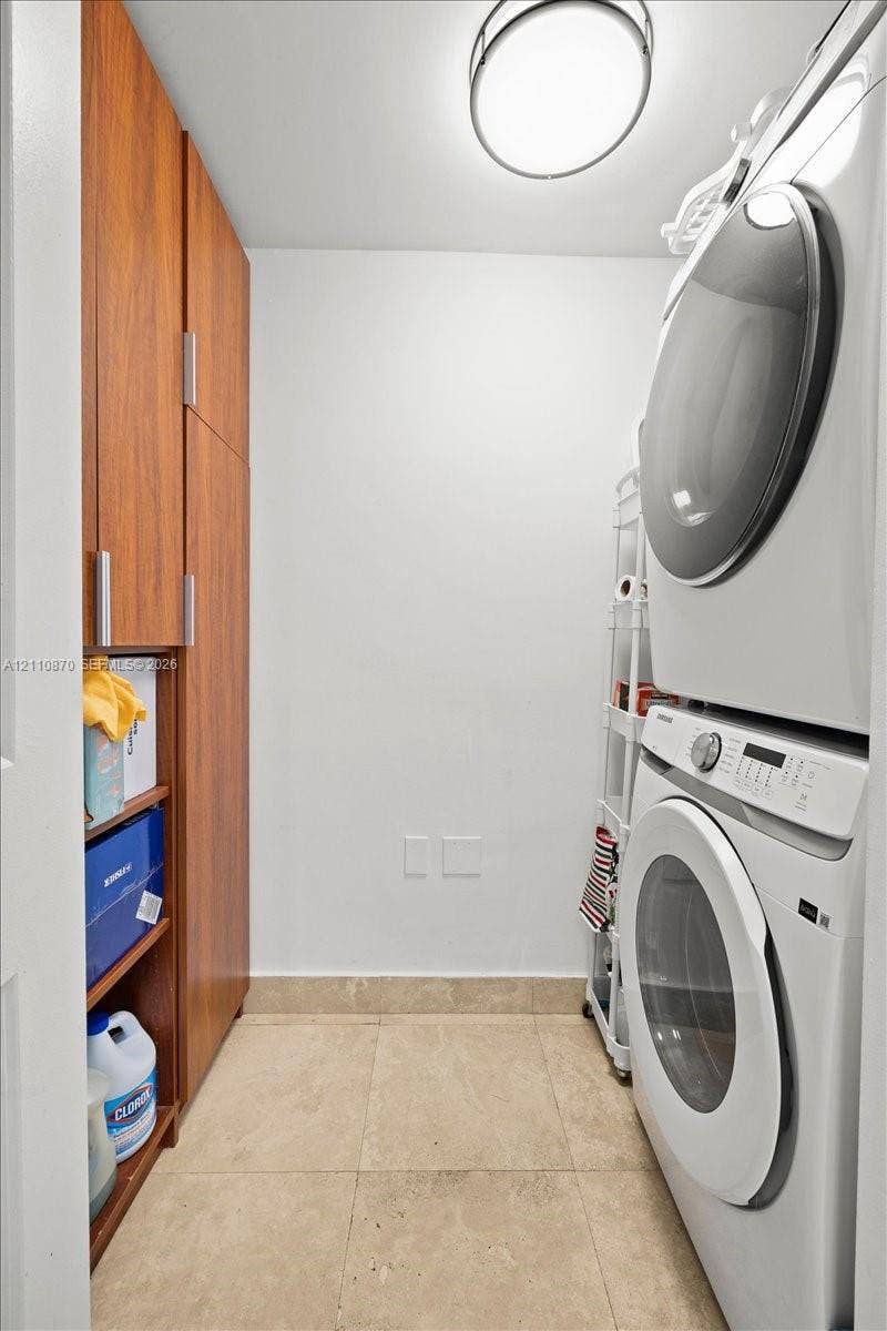1755 E Hallandale Beach Boulevard, #MEZ5E, Hallandale Beach, FL 33009 Built-in floor-to-ceiling wood-finish cabinetry, tile flooring, and flush-mount overhead lighting