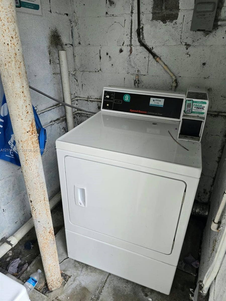 535 NW 7th Street, #10, Miami, Miami, FL 33136 Commercial-grade dryer featuring a white finish and integrated payment console