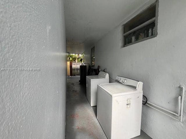 7230 NW 3rd Street, #4, Miami, Miami, FL 33126 Covered exterior utility area featuring concrete flooring, smooth wall finishes, and a horizontal sliding window