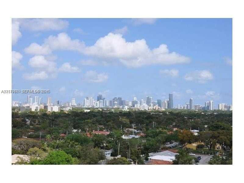 2600 SW 27th Avenue, #702, Miami, FL 33133 Expansive urban skyline panorama featuring high-rise architecture and mature tree canopy