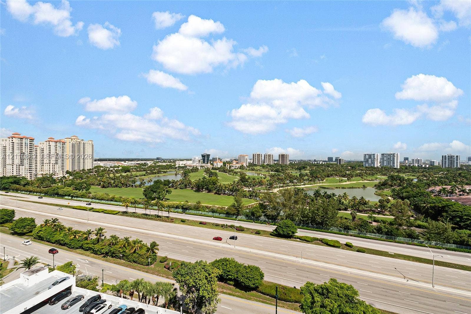 Elevated perspective featuring sprawling green space, mature landscaping, and an expansive horizon line