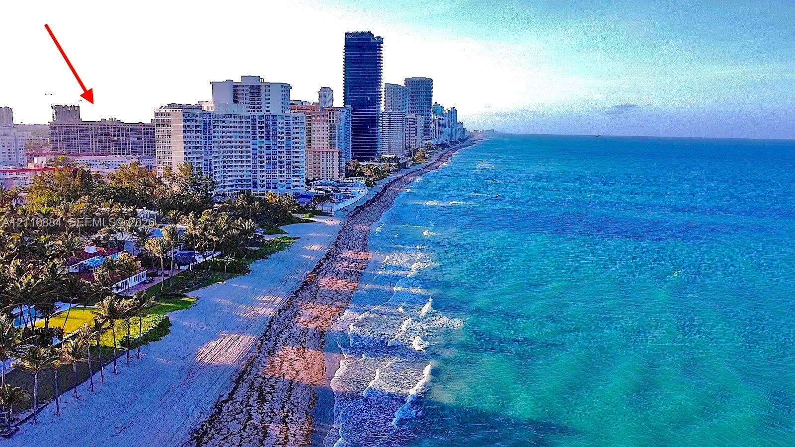 400 Diplomat Parkway, #805, Hallandale Beach, FL 33009 Aerial perspective featuring coastal shoreline and high-rise development