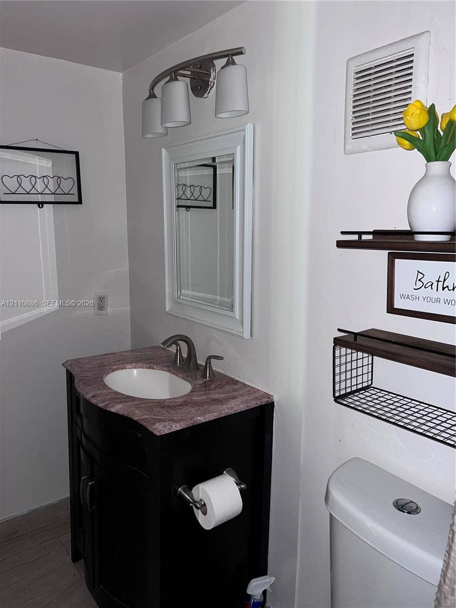 7101 Miami Lakes Drive, #Q12, Miami Lakes, Miami Lakes, FL 33014 Neutral-toned walls, tile flooring, multi-pane window with wood-trim finish, and a circular flush-mount ceiling light