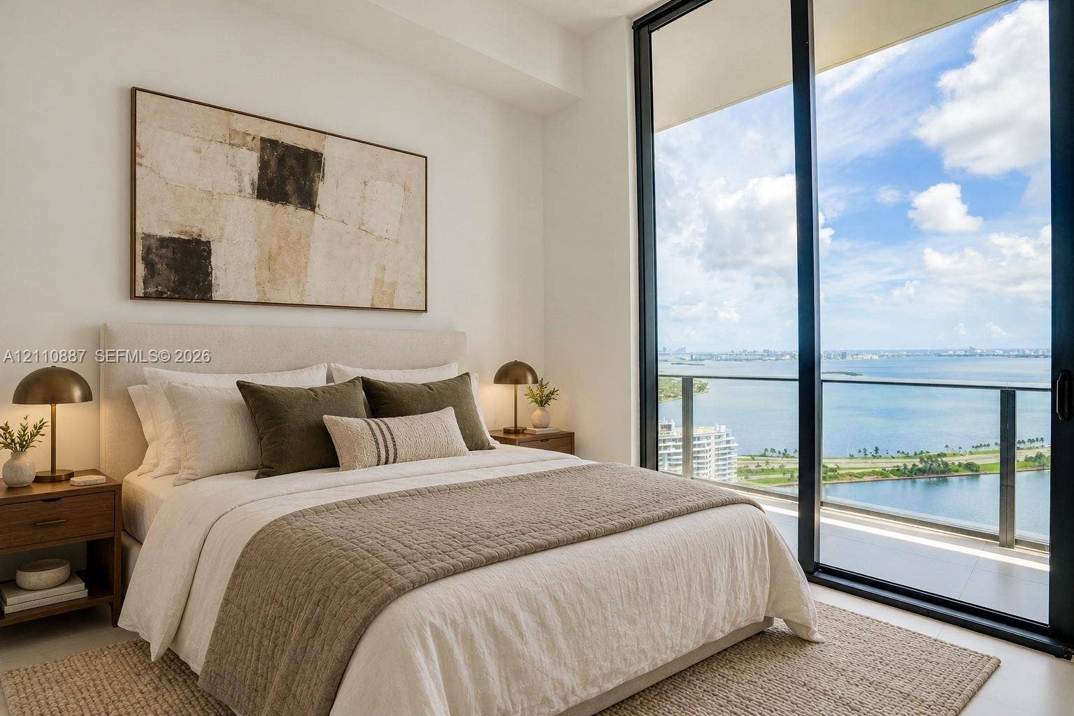501 NE 31st Street, #4002, Miami, FL 33137 Floor-to-ceiling glass sliding doors, private balcony, and extensive water scenery
