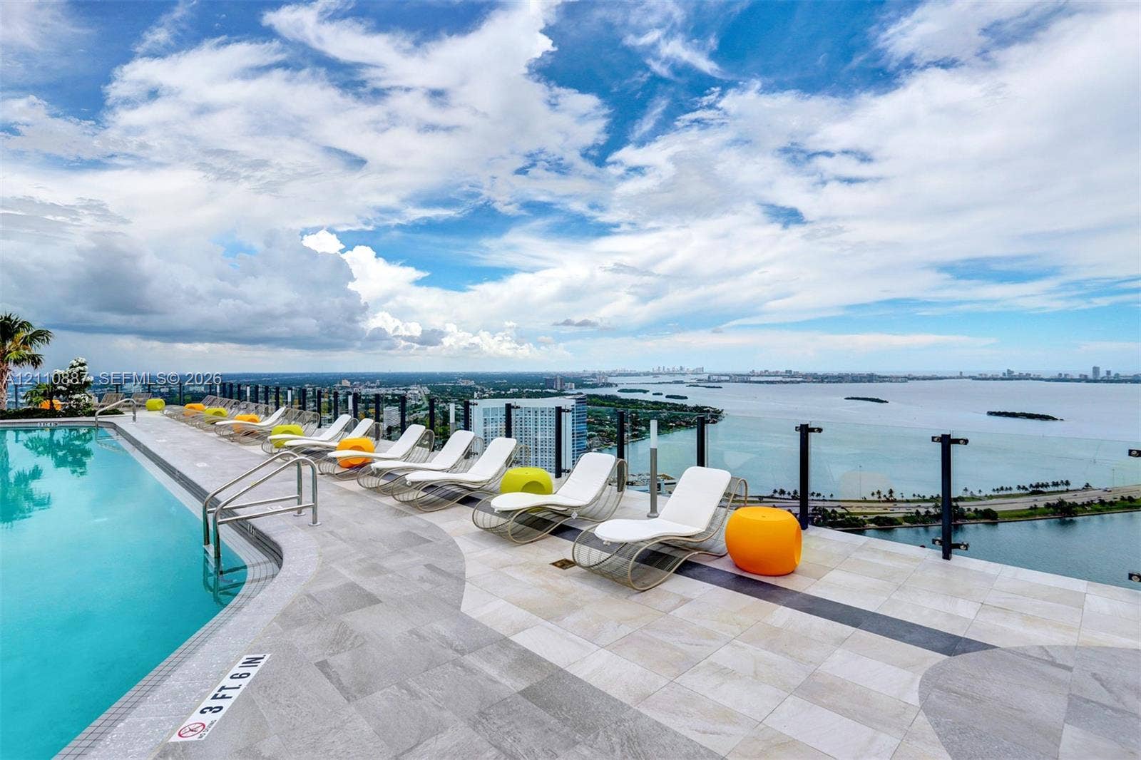 501 NE 31st Street, #4002, Miami, FL 33137 Rooftop swimming pool with tiled decking and glass panel perimeter railing