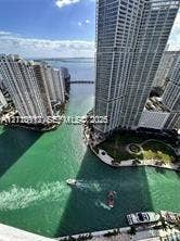 High-rise exterior featuring a waterfront location, deep-water channel, and extensive glass facade