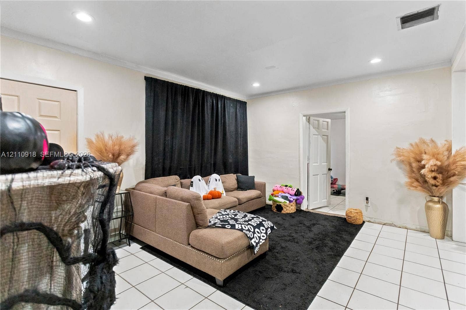 2007 NW 89th Street, Miami, FL 33147 Interior space featuring recessed lighting, white tile flooring, and solid-core interior doors