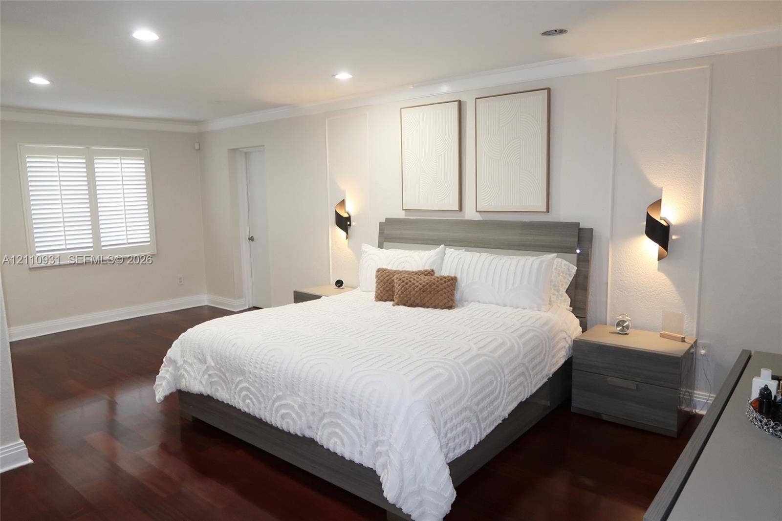 3005 SW 99th Court, Miami, FL 33165 Hardwood flooring, recessed lighting, wall-mounted accent lighting, framed wall paneling, and shutter-style window coverings