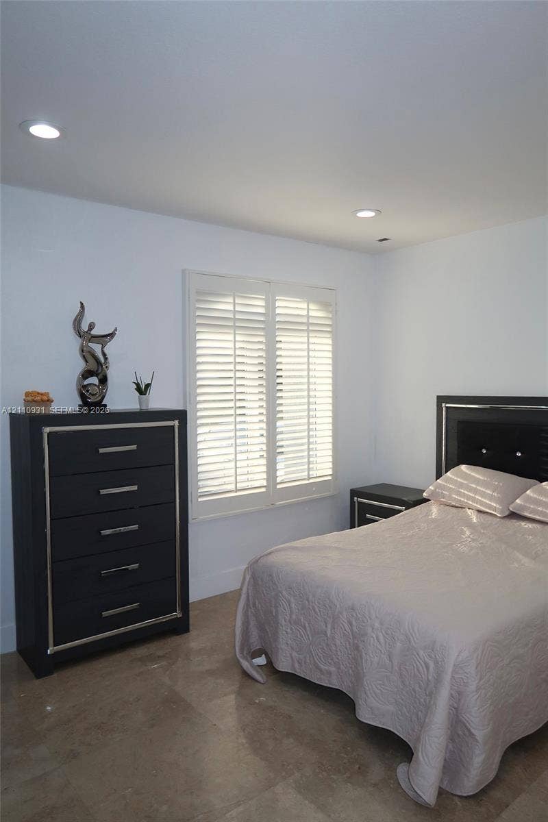 3005 SW 99th Court, Miami, FL 33165 Room featuring tile flooring, white plantation shutters, and recessed ceiling lighting