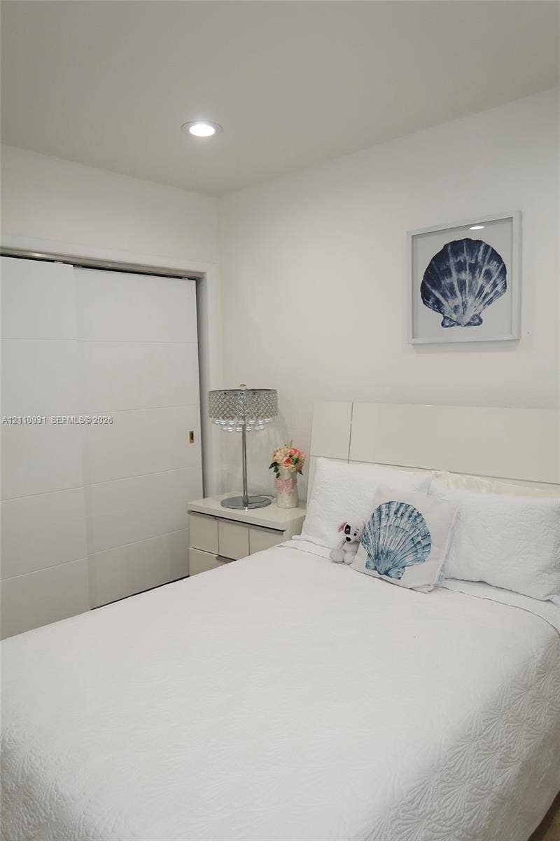 3005 SW 99th Court, Miami, FL 33165 Room featuring a neutral color palette, recessed lighting, and a sliding panel closet door