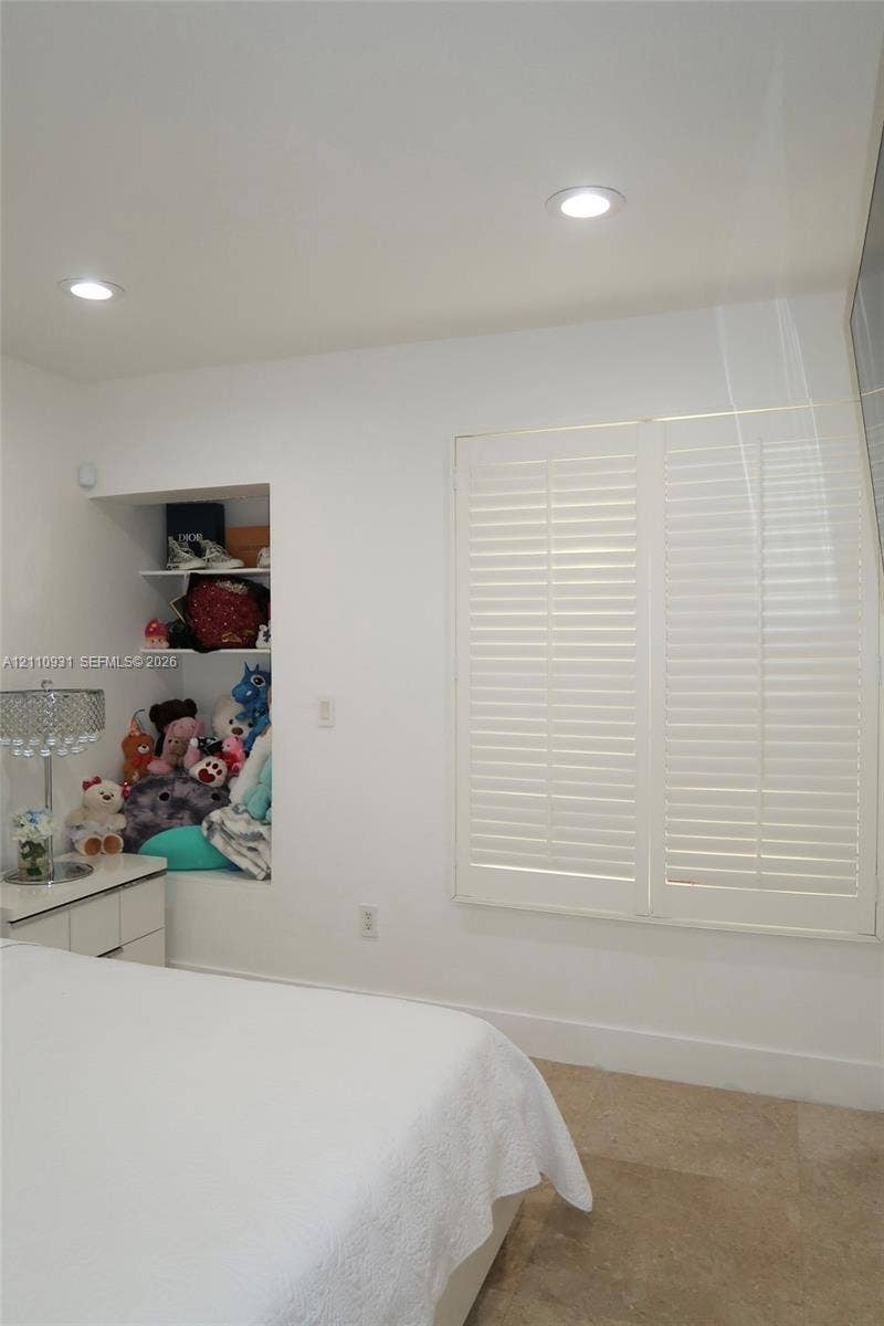 3005 SW 99th Court, Miami, FL 33165 Built-in recessed shelving, plantation shutters, recessed lighting, and stone flooring