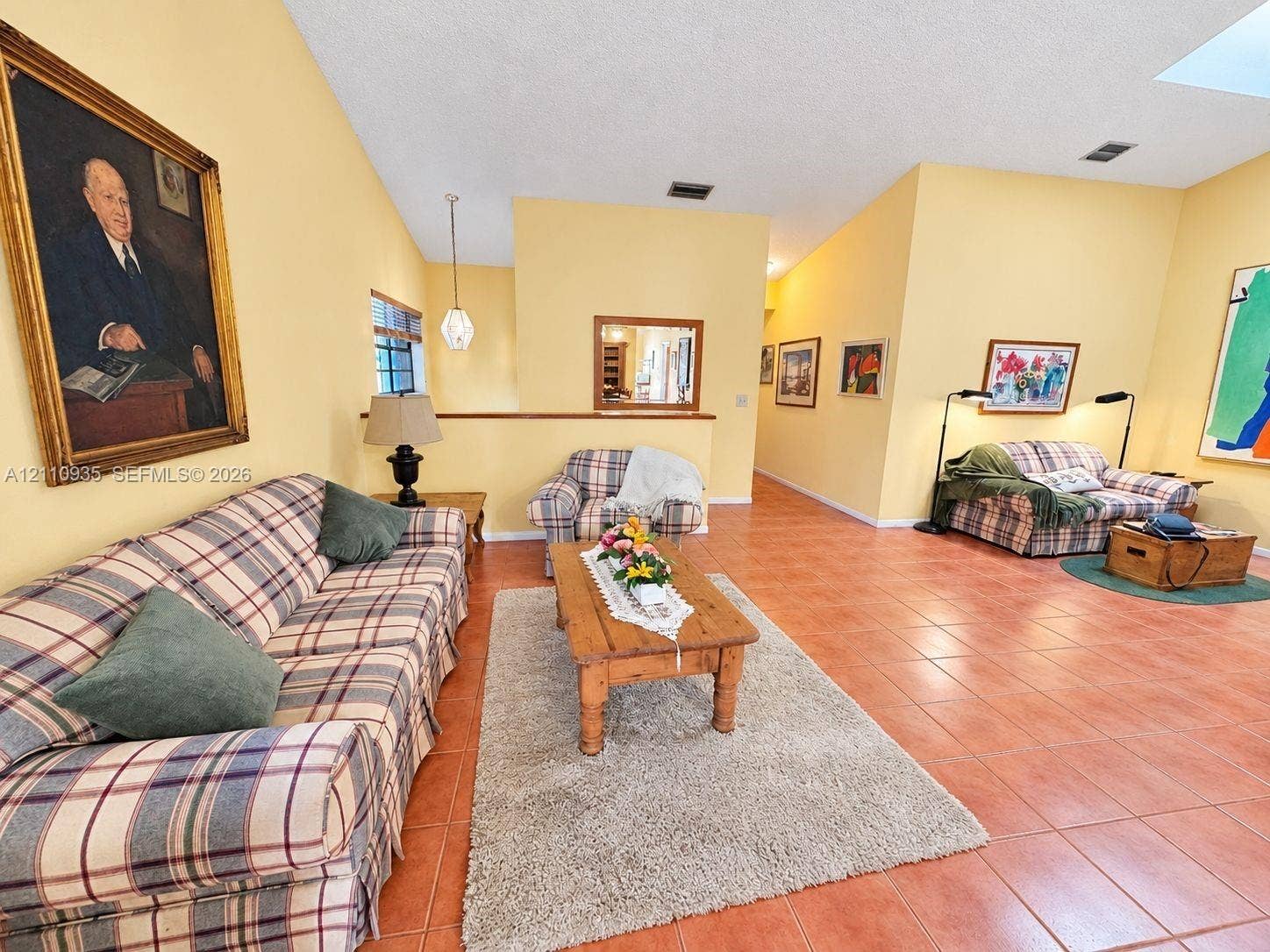 3530 Magellan Circle, #618, Aventura, FL 33180 Vaulted ceilings, ceramic tile flooring, and a pendant light fixture