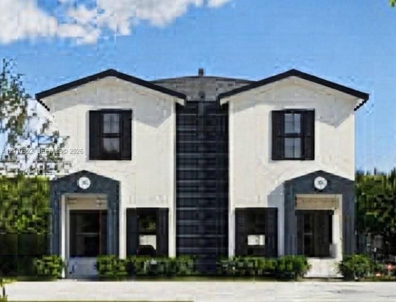 1225 NW 9 Avenue, #0, Florida City, Florida City, FL 33034 Two-story exterior featuring a high-contrast facade, dual-gabled rooflines, dark-trimmed window shutters, and symmetrical entryway surrounds