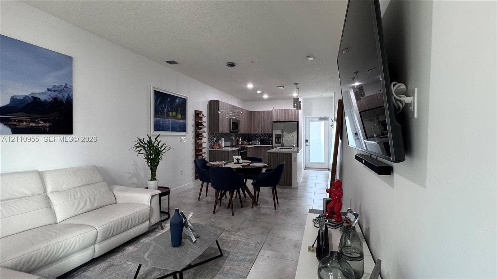 4636 NW 84th Avenue, #35, Doral, FL 33166 Kitchen featuring wood-finish cabinetry, recessed ceiling lighting, and tile flooring