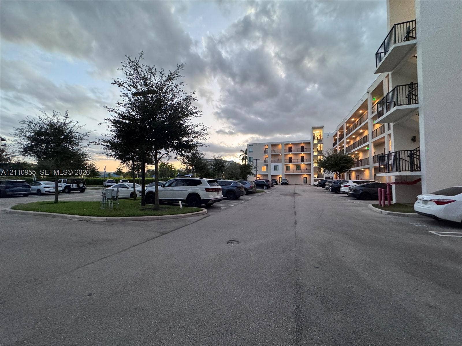 4636 NW 84th Avenue, #35, Doral, FL 33166 Multi-story residential complex featuring stucco exterior walls, private metal-railed balconies, and surface parking