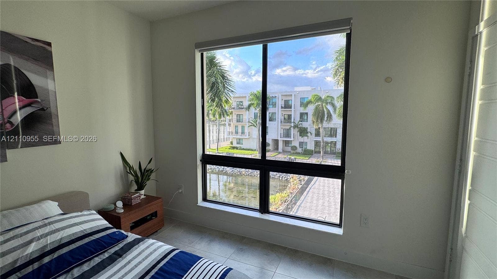 4636 NW 84th Avenue, #35, Doral, FL 33166 Large window with black framing and tile flooring