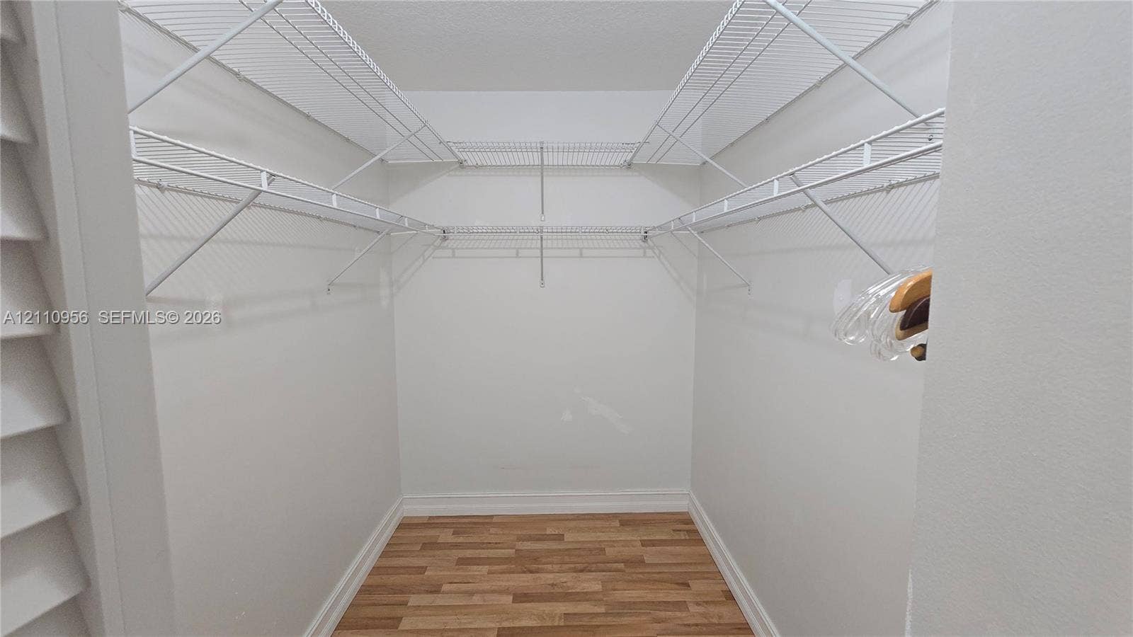 2120 SW 94th Terrace, #404, Davie, FL 33324 Storage area featuring wood-finish flooring and multi-level white wire shelving