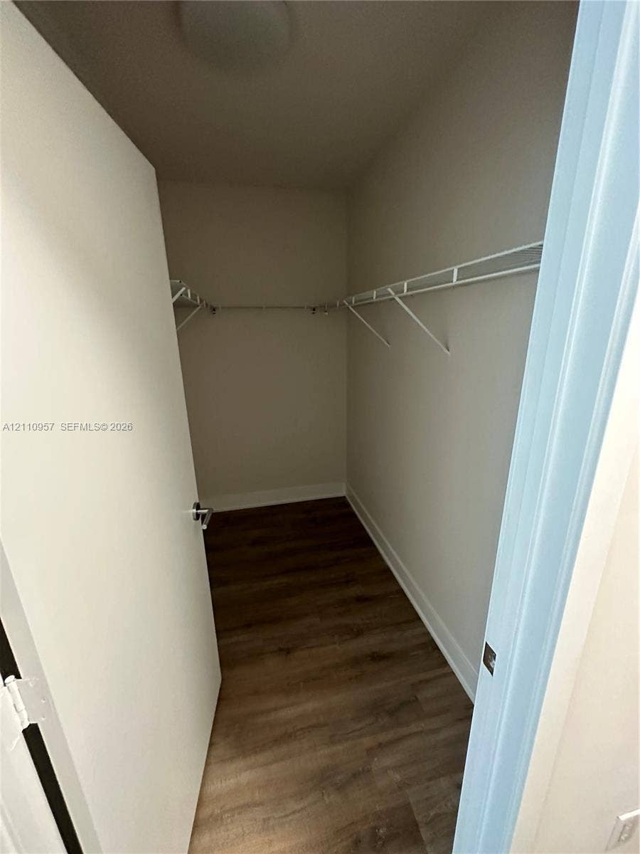 12115 NE 5th Avenue, #12115, North Miami, North Miami, FL 33161 Walk-in storage space featuring wood-finish flooring and wall-mounted wire shelving