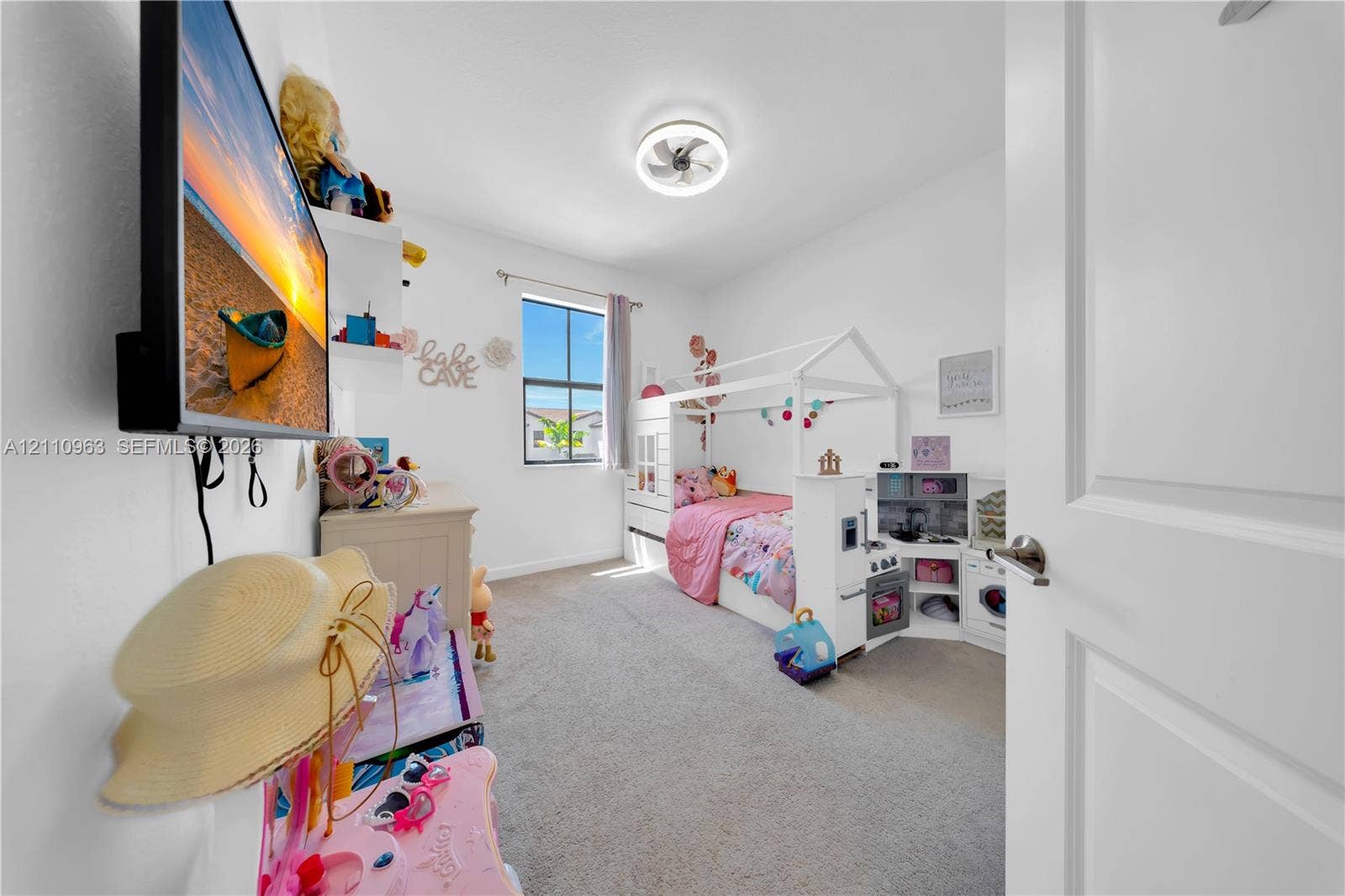 23436 SW 129th Avenue, #23436, Homestead, Homestead, FL 33032 Bedroom featuring wall-to-wall carpeting, single-pane window, built-in shelving, and a modern circular ceiling-mounted light fixture