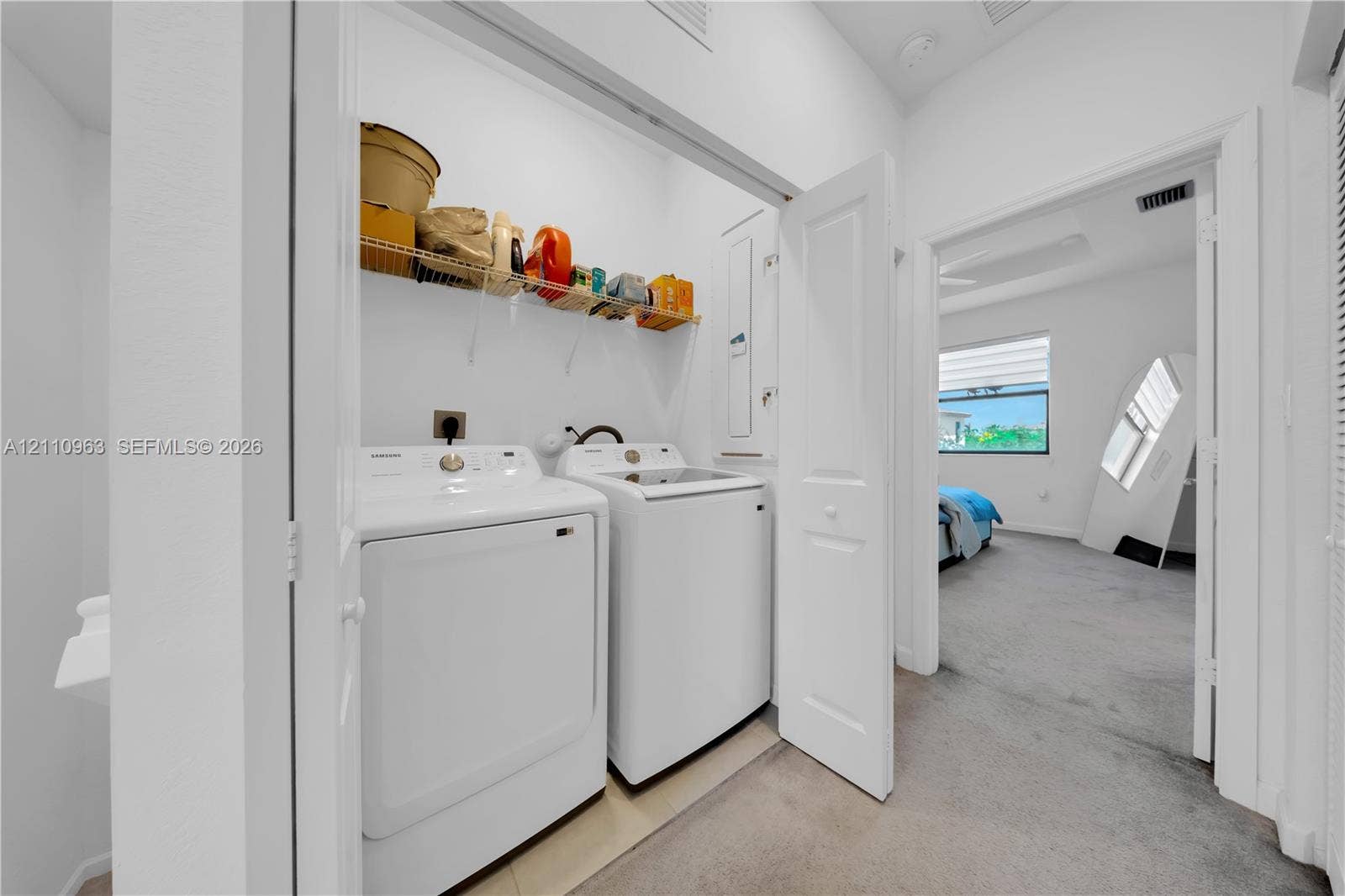 23436 SW 129th Avenue, #23436, Homestead, Homestead, FL 33032 Laundry closet featuring wire shelving and neutral carpeting