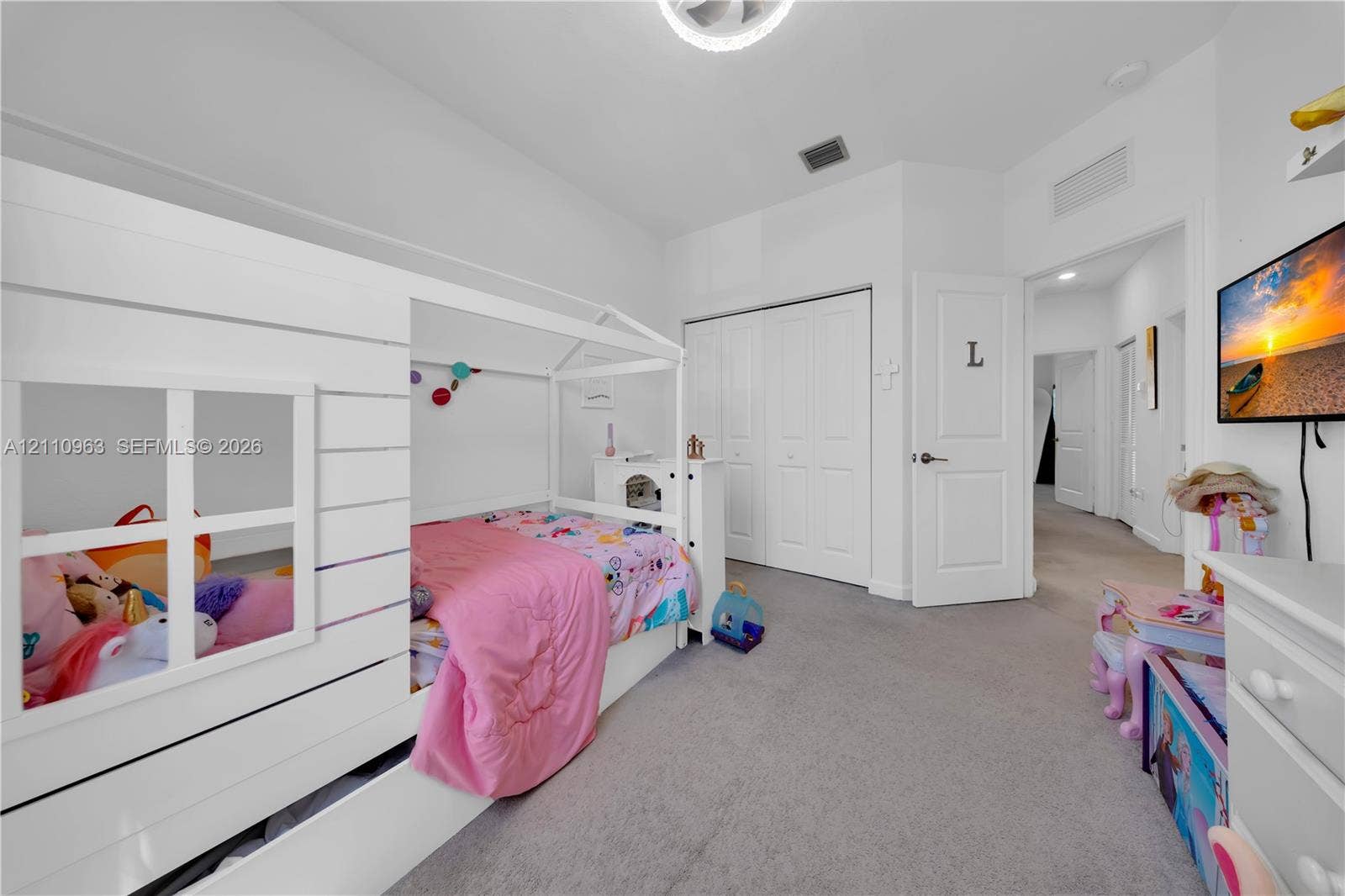 23436 SW 129th Avenue, #23436, Homestead, Homestead, FL 33032 Bedroom featuring neutral wall-to-wall carpeting, multi-panel closet doors, and an overhead flush-mount light fixture