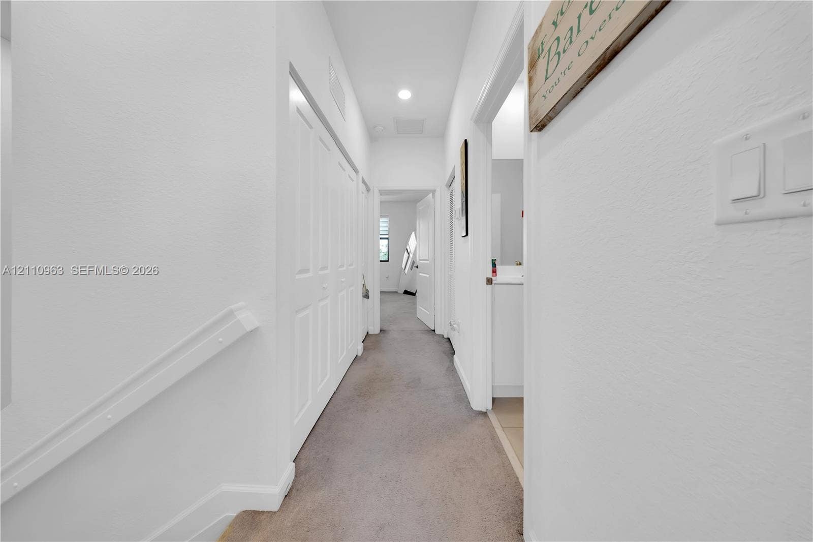 23436 SW 129th Avenue, #23436, Homestead, Homestead, FL 33032 Hallway featuring neutral carpeting, multi-panel doors, and recessed lighting
