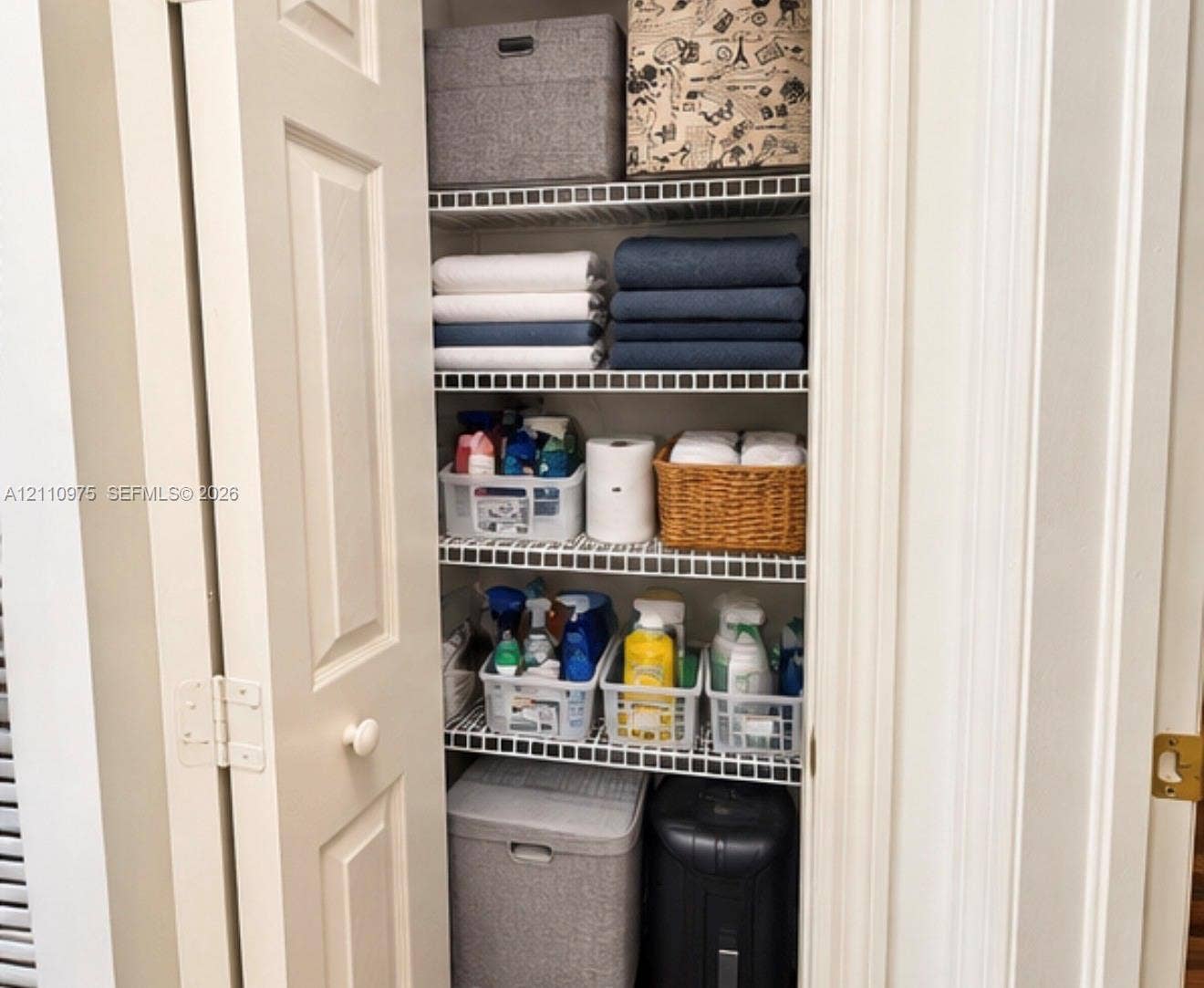 2030 NW 99th Terrace, Pembroke Pines, FL 33024 Storage closet featuring multi-tiered wire shelving and double-panel doors