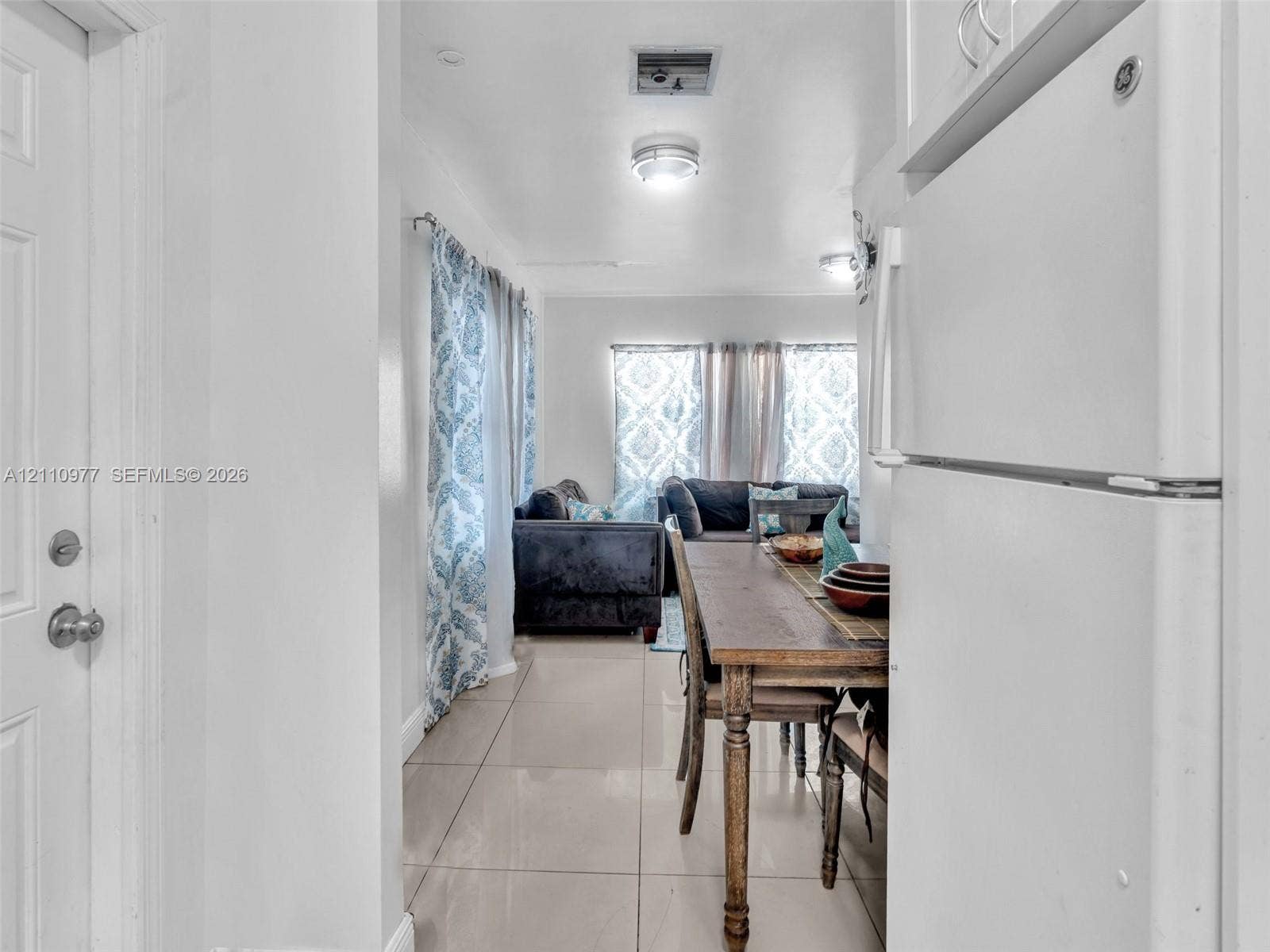 2126 Cleveland Street, #2126, Hollywood, Hollywood, FL 33020 Neutral-toned tile flooring, white cabinetry, and recessed ceiling lighting