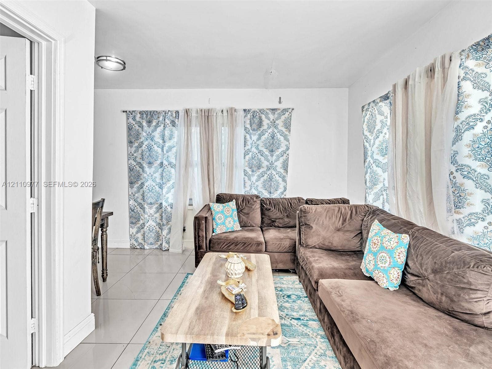 2126 Cleveland Street, #2126, Hollywood, Hollywood, FL 33020 Neutral wall color, large-format tile flooring, and flush-mount ceiling lighting