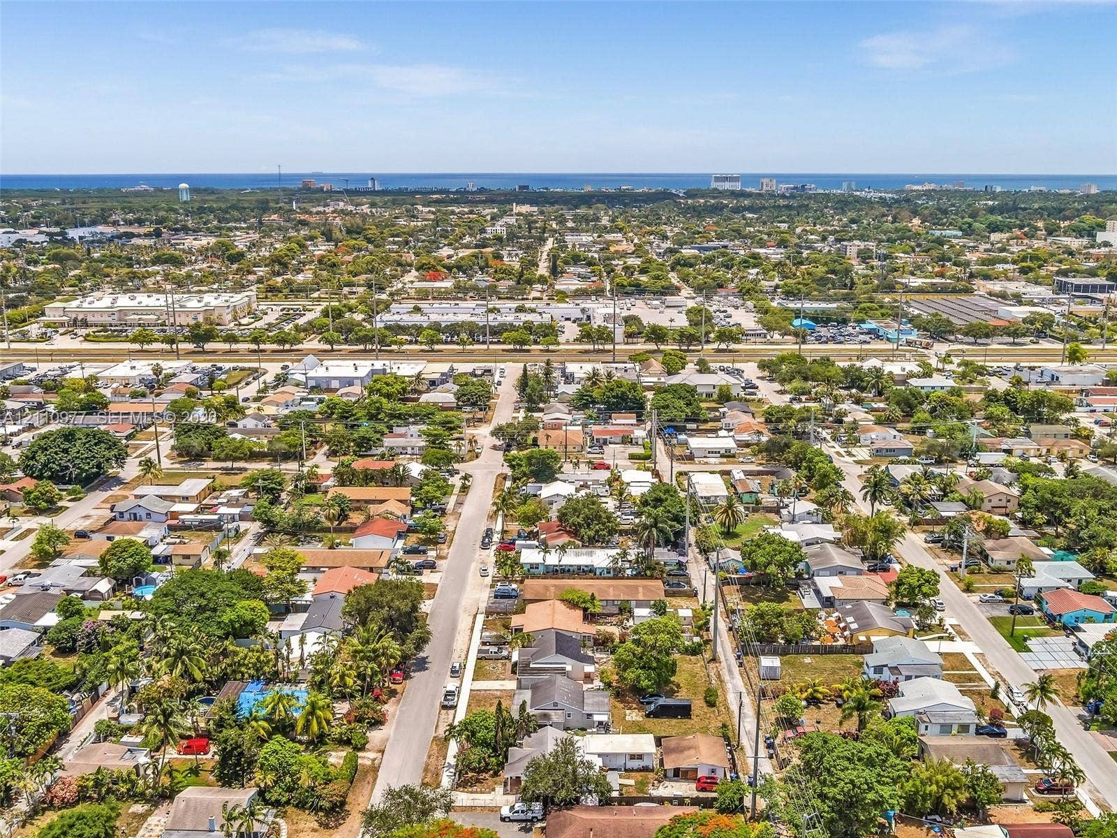 2126 Cleveland Street, #2126, Hollywood, Hollywood, FL 33020 Aerial perspective featuring an established residential neighborhood with mature canopy trees and proximity to the coastline