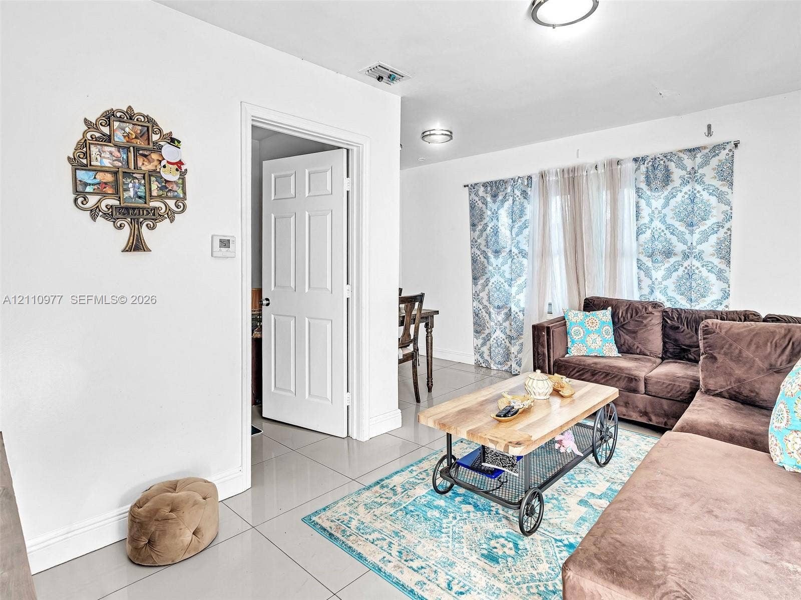 2126 Cleveland Street, #2126, Hollywood, Hollywood, FL 33020 Large-format tile flooring, flush-mount ceiling lighting, and a multi-panel interior door