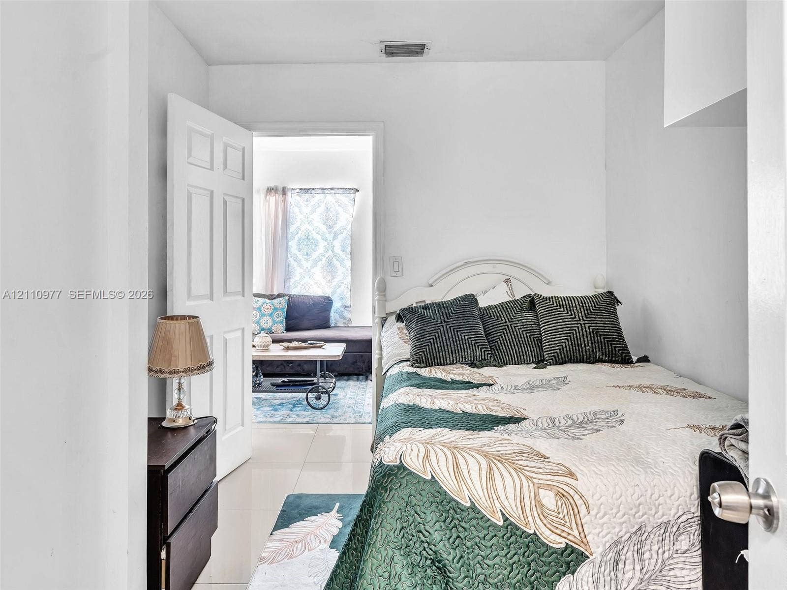 2126 Cleveland Street, #2126, Hollywood, Hollywood, FL 33020 Neutral wall color, high-gloss tile flooring, and a classic six-panel interior door