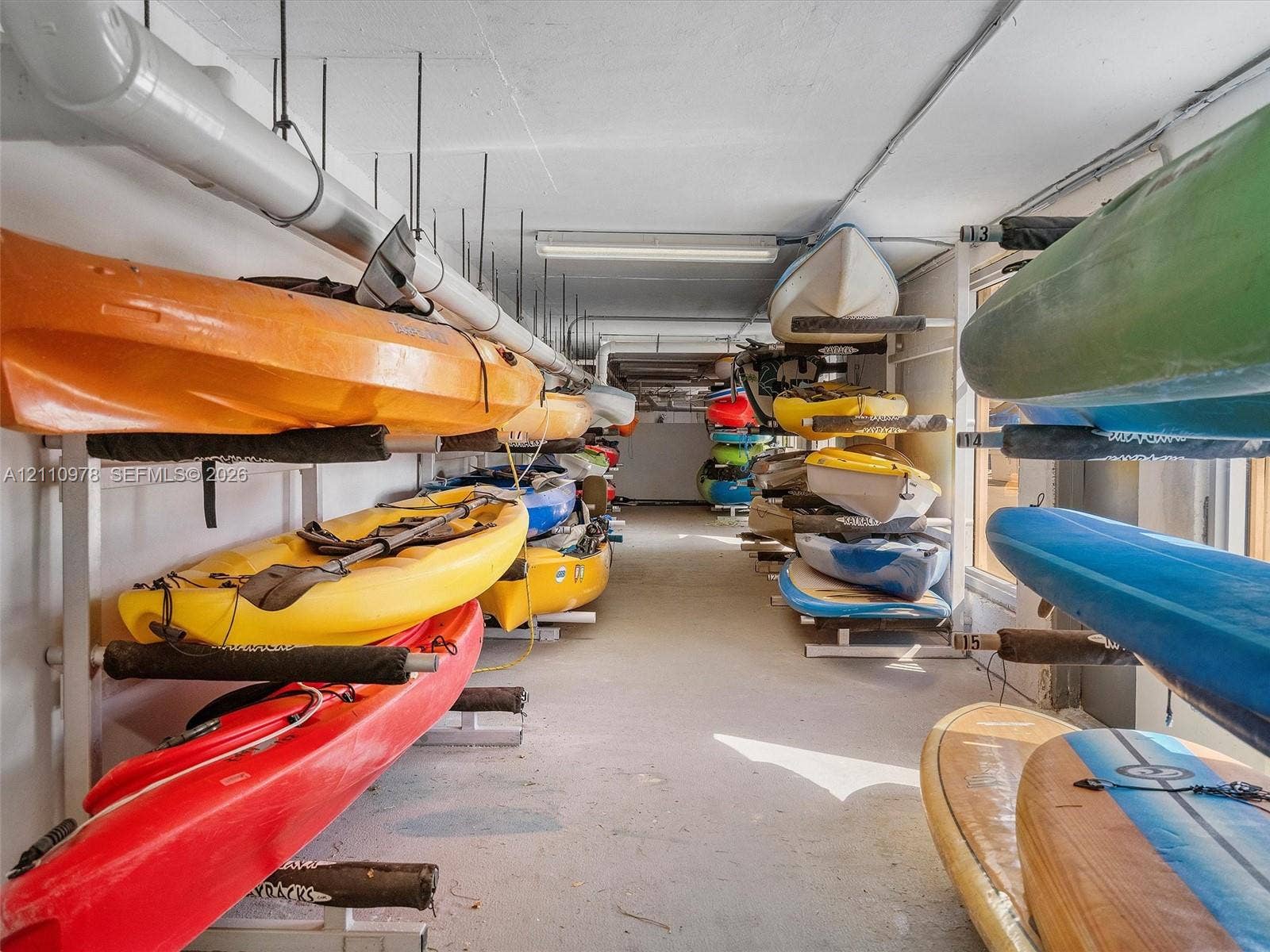 900 Bay Drive, #225, Miami Beach, FL 33141 Dedicated storage area featuring multi-level metal racking systems for watercraft
