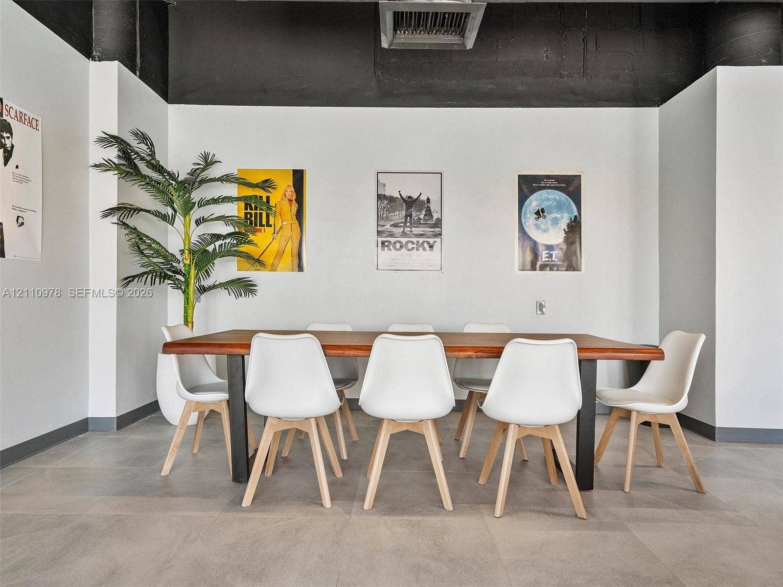 900 Bay Drive, #225, Miami Beach, FL 33141 Large-format tile flooring, high exposed ceilings with matte black finish, and industrial-style painted wall accents