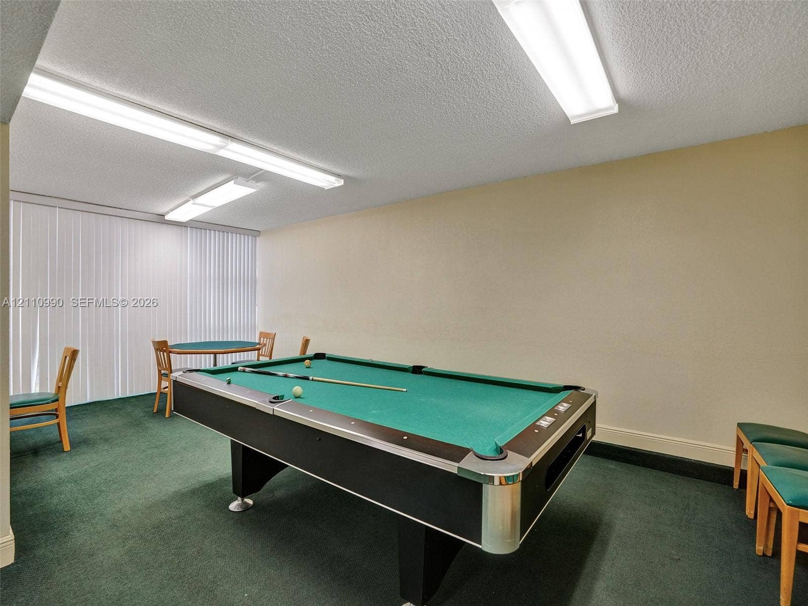 800 Parkview Drive, #131, Hallandale Beach, FL 33009 Expansive room featuring wall-to-wall carpeting, recessed fluorescent lighting, and vertical window blinds