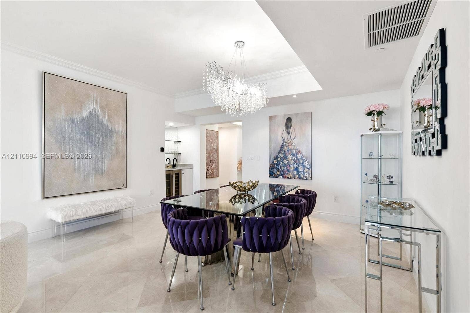 17875 Collins Avenue, #2405, Sunny Isles Beach, Sunny Isles Beach, FL 33160 Dining area featuring polished stone tile flooring, a recessed ceiling design, and a tiered crystal chandelier