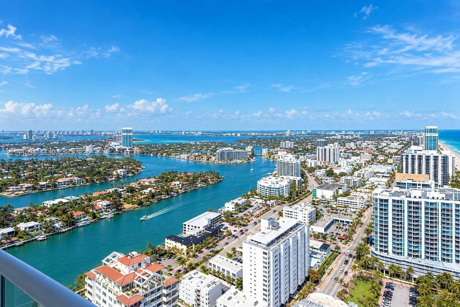 6365 Collins Avenue, #3811, Miami Beach, FL 33141 Aerial perspective featuring expansive coastal waterways, high-rise architecture, marina access, and proximity to the Atlantic shoreline