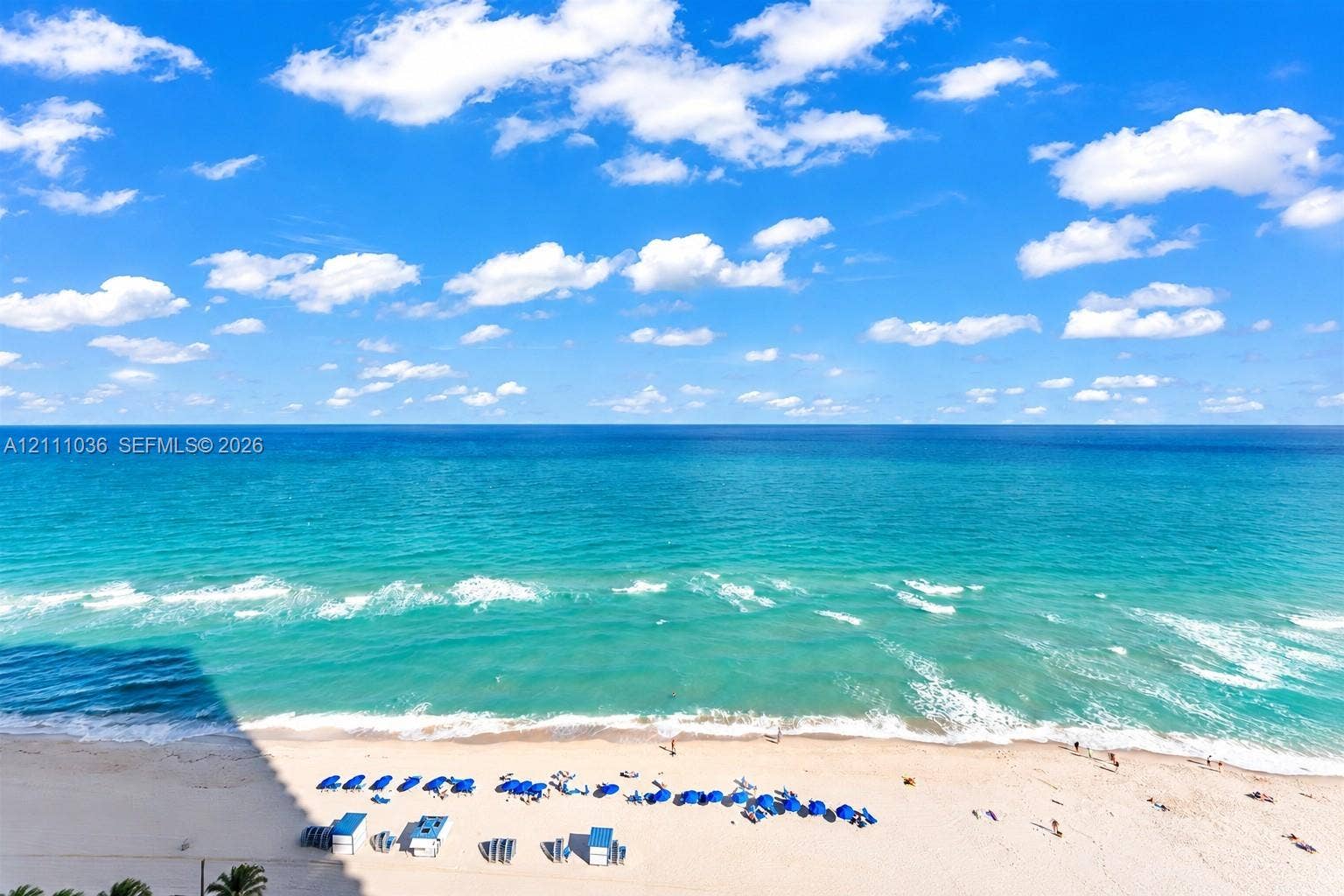 6365 Collins Avenue, #3811, Miami Beach, FL 33141 Elevated horizon with expansive ocean water, sandy shoreline, and clear skies