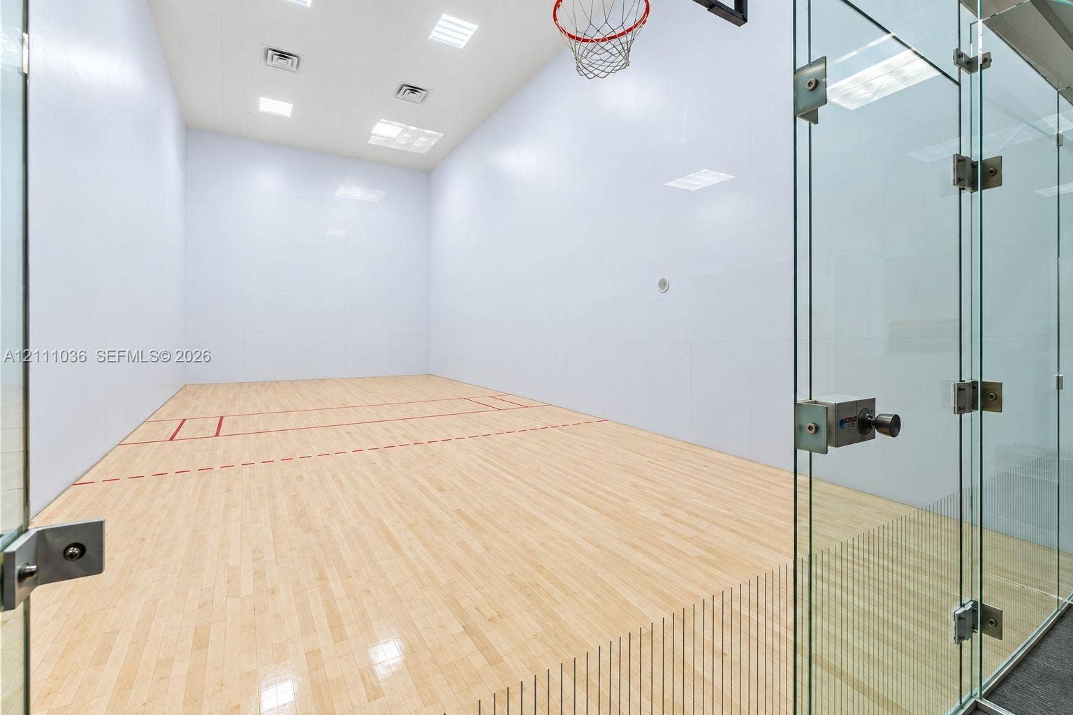 6365 Collins Avenue, #3811, Miami Beach, FL 33141 Recreational court featuring wood-finish flooring, high-impact walls, glass enclosure, and overhead recessed lighting
