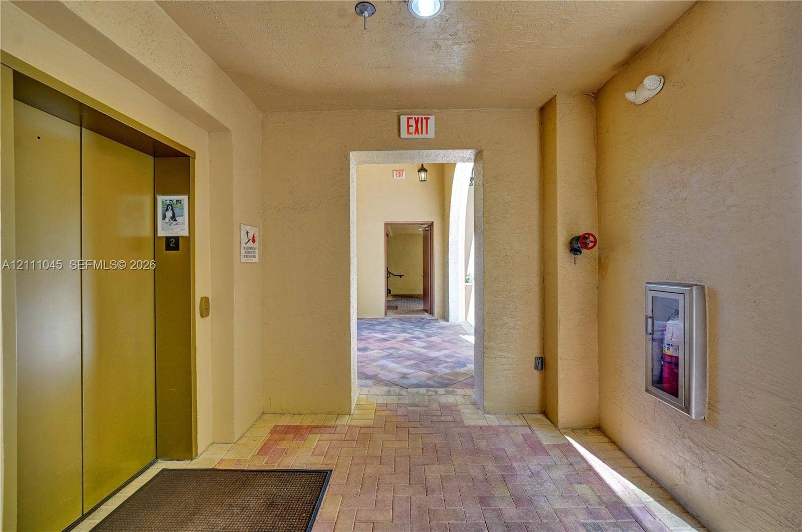 2901 NW 126th Avenue, #2-225, Sunrise, FL 33323 Elevator access, brick paver flooring, and recessed ceiling lighting