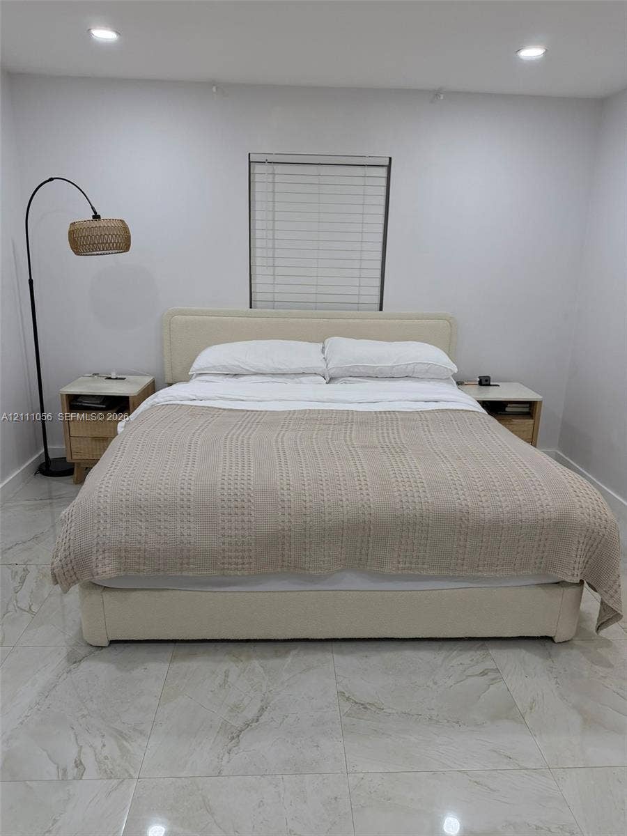 5020 Sheridan Street, #2, Hollywood, FL 33021 Large-format tile flooring, recessed ceiling lighting, and horizontal window blinds