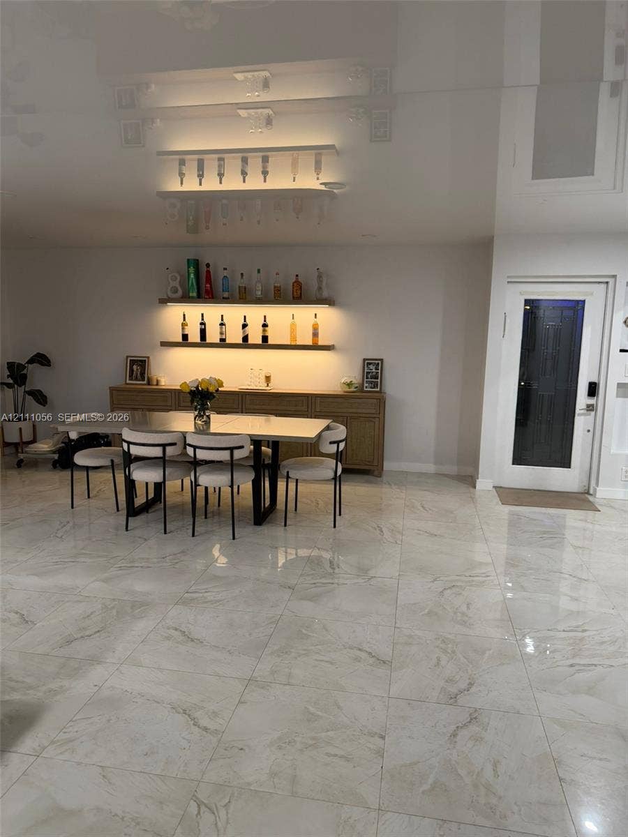 5020 Sheridan Street, #2, Hollywood, FL 33021 Large-format tile flooring, recessed ceiling lighting, and smart thermostat interface