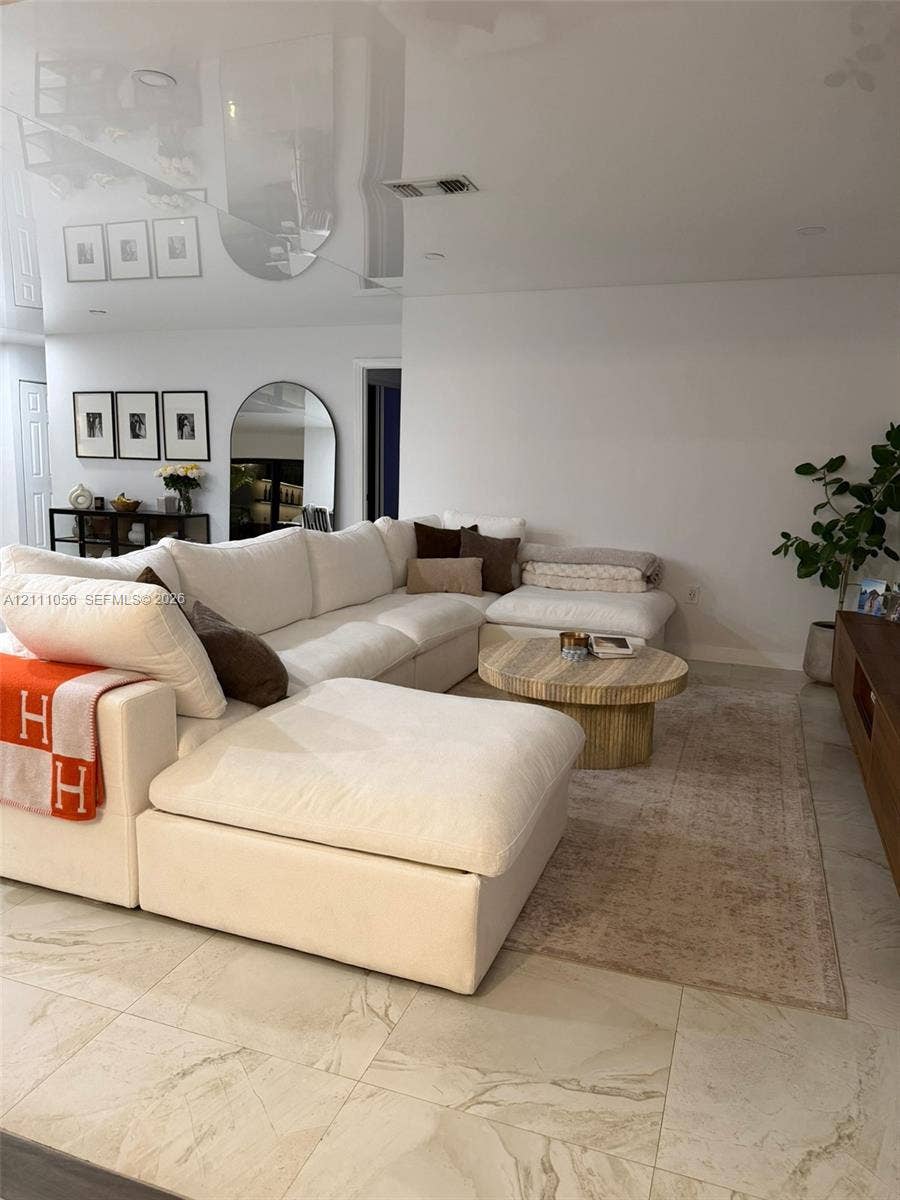 5020 Sheridan Street, #2, Hollywood, FL 33021 High-gloss reflective ceiling finish, expansive stone-finish tile flooring, and recessed lighting
