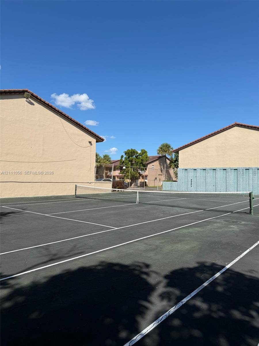 5020 Sheridan Street, #2, Hollywood, FL 33021 Hard-court tennis facility with painted boundary lines, permanent net, and perimeter fencing