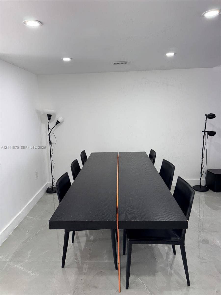 2318 NE 7th Street, #34, Hallandale Beach, Hallandale Beach, FL 33009 Neutral walls paired with high-gloss tile flooring and recessed overhead lighting