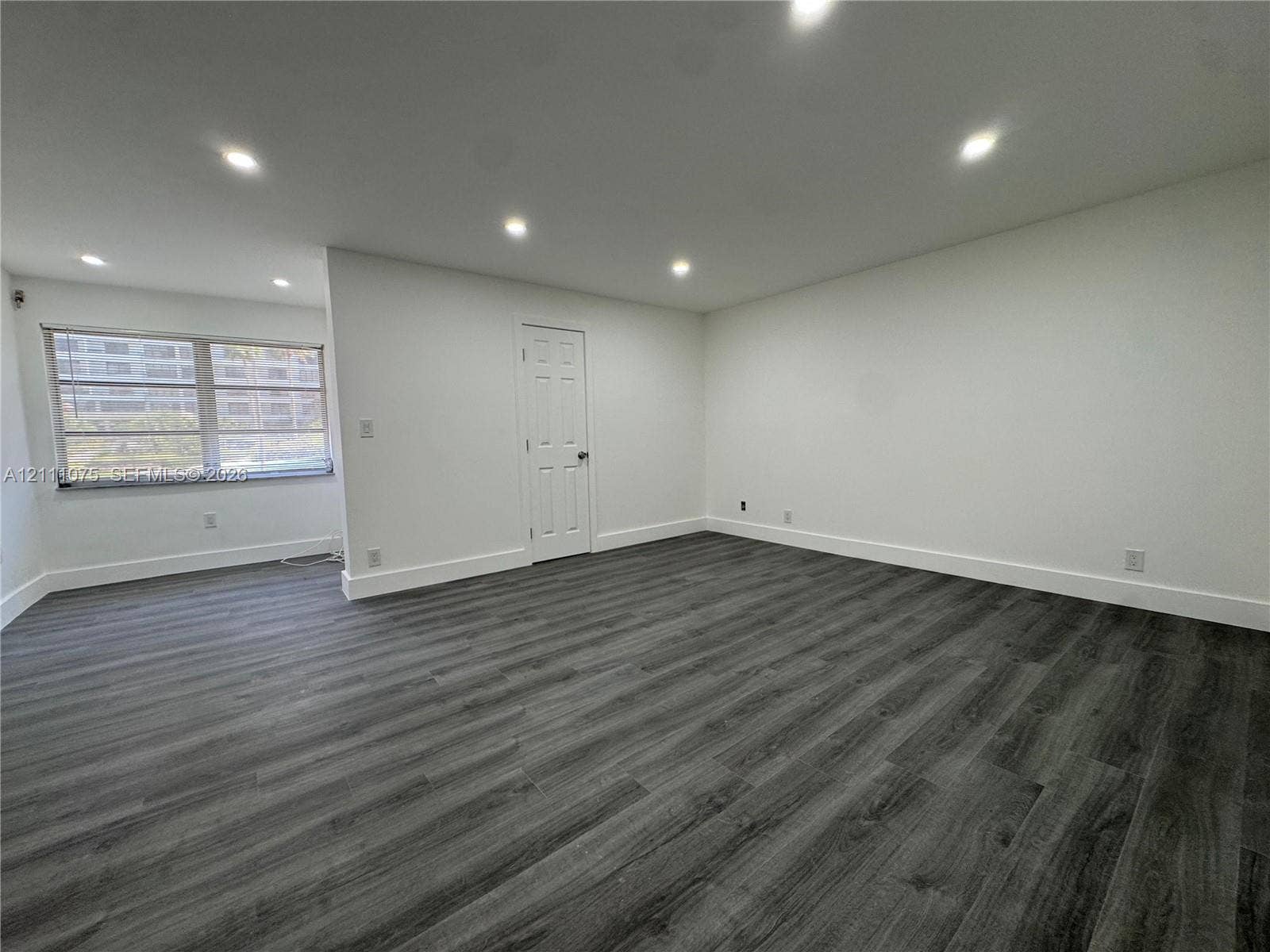 2318 NE 7th Street, #34, Hallandale Beach, Hallandale Beach, FL 33009 Interior space featuring wood-finish flooring, recessed lighting, and a neutral color palette