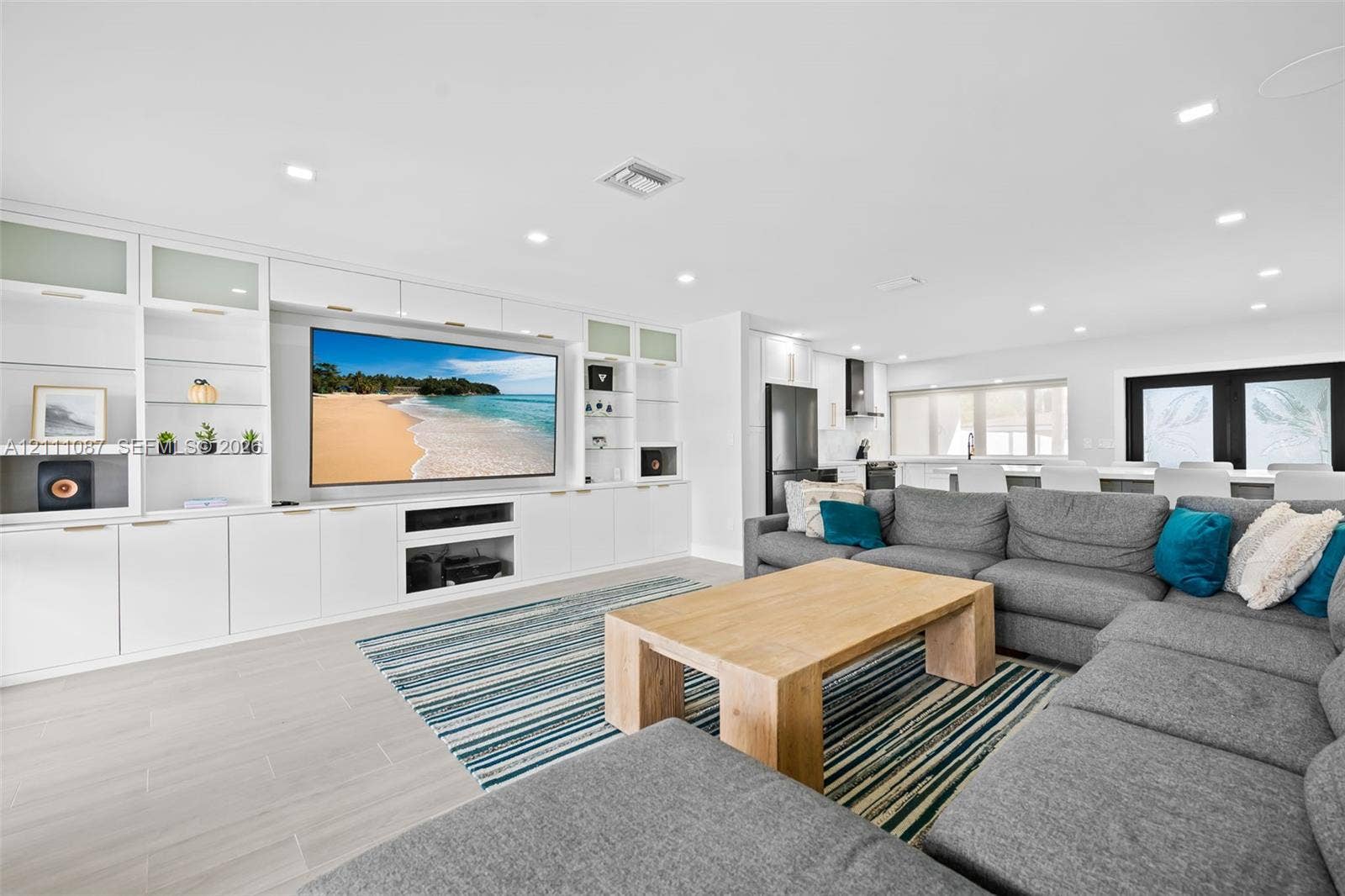822 Polk Street, Hollywood, FL 33019 Custom floor-to-ceiling built-in cabinetry, recessed lighting, and large-format tile flooring