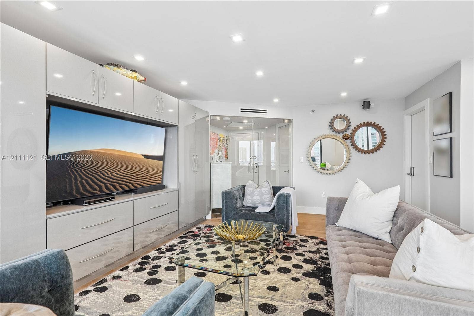 3300 NE 192nd Street, #1813, Aventura, FL 33180 Built-in high-gloss cabinetry, recessed ceiling lighting, and glass-enclosed entry