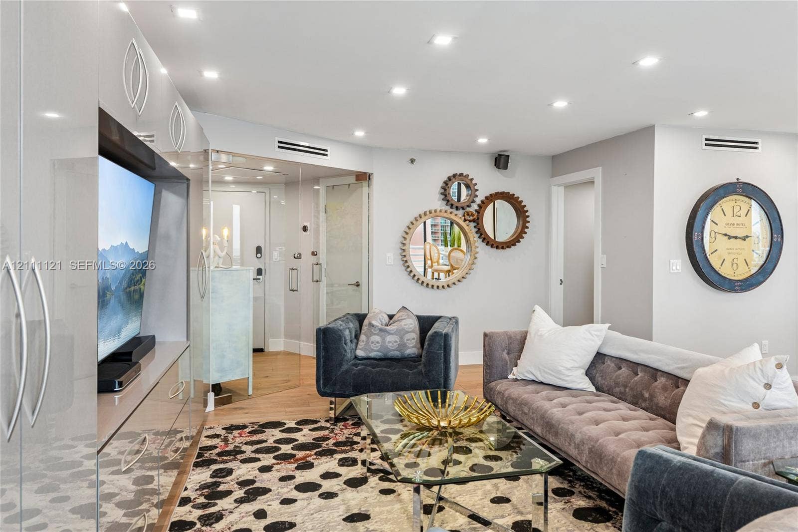 3300 NE 192nd Street, #1813, Aventura, FL 33180 Recessed lighting, wood-finish flooring, high-gloss built-in cabinetry, and glass-paneled interior entry