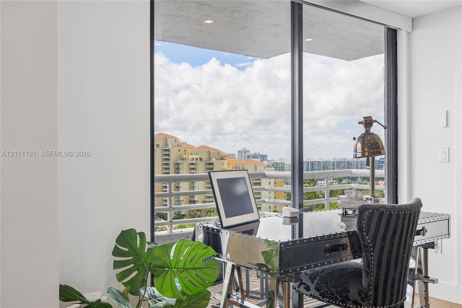 3300 NE 192nd Street, #1813, Aventura, FL 33180 Floor-to-ceiling glass paneling featuring a metal frame and attached balcony
